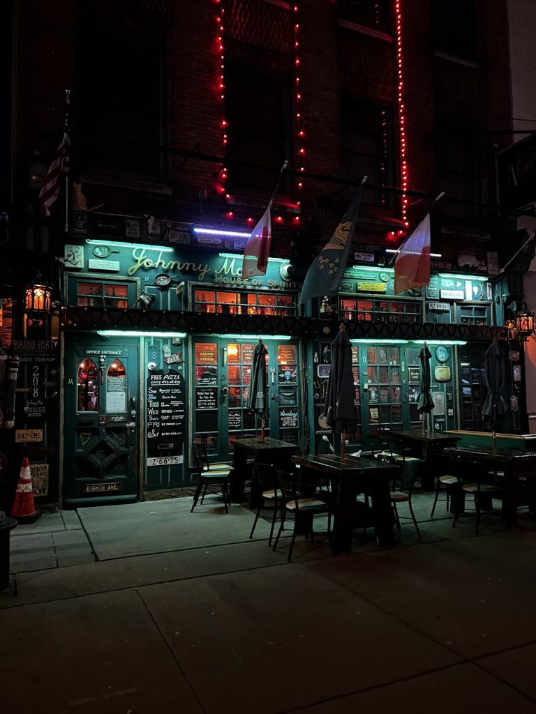 Johnny Mac's House of Spirits storefront lit up at night, Asbury Park NJ